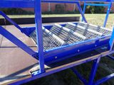 a blue cart that has a bunch of metal items in it