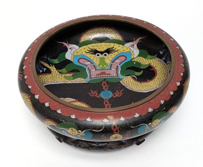 a black and red box with a dragon on it