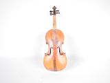 an old violin sitting on a white surface with a white background