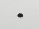 a close up of a small black stone on a white surface
