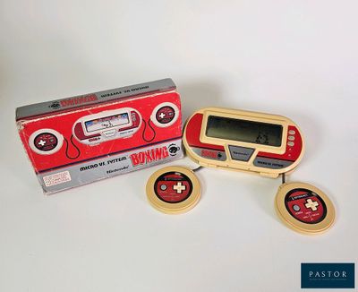 un petit appareil électronique posé à côté d'une boîte
