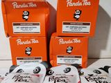 three packages of panda tea sitting on top of a table