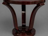 a round table with a wooden base and a wooden top