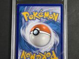a close up of a pokemon card in a plastic case