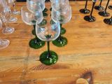 many wine glasses sitting on a table with a price tag