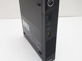 a black desktop computer sitting on top of a white table