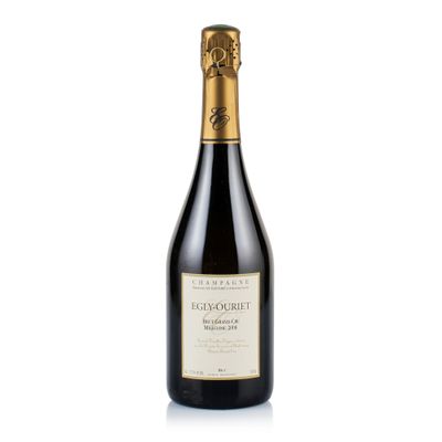 a bottle of wine with a gold cap on a white background
