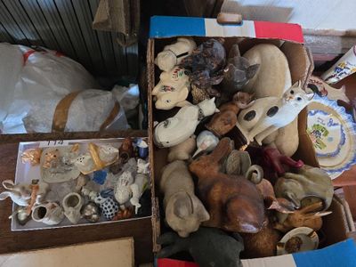 a box full of stuffed animals sitting on the floor