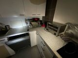 a microwave and a toaster sitting on a counter in a kitchen