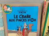 three children ' s books are sitting on a shelf next to each other