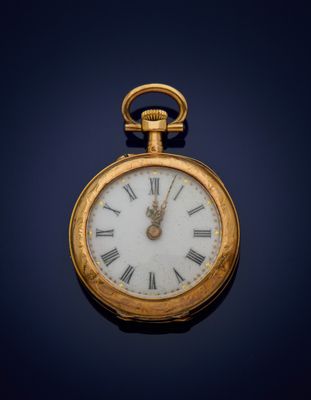 an old gold pocket watch with roman numerals on the face