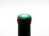 a bottle of wine that is sitting on a table