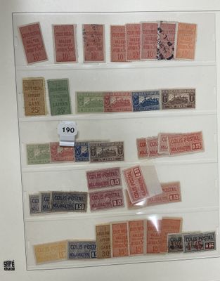 many different types of stamps on display in a glass case