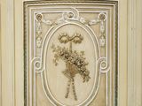 a white cabinet with a decorative design on it