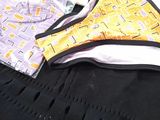 a woman ' s underwear and a bra top on a bed