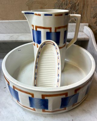 two cups that are sitting in a bowl on the counter