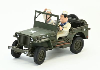 deux figurines représentant un homme et une femme à bord d'une jeep