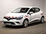 une voiture blanche avec des bandes rouges garée dans un garage