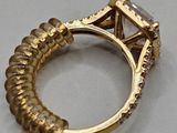 an image of a gold ring with a diamond on top of it