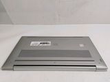a laptop that is sitting on a white surface