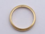 an image of a close up of a gold ring on a white surface