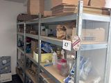 a room that has a lot of shelves and boxes on it