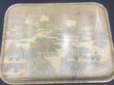 a tray with a picture on it sitting on a table