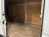 a white van with a wooden floor in the back of it