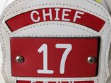 a close up of a fireman ' s helmet with the number 17 on it
