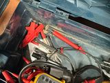 a box full of electrical tools on a table