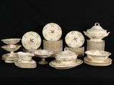 a lot of plates and bowls on a black background