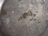 a close up view of a metal object with holes in it