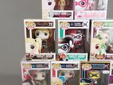 a lot of pop vinyl figures on display in the box