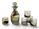 four glasses and a decanter on the table