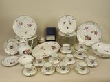 many different types of plates and bowls on the table