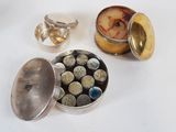 a silver container filled with different types of rocks