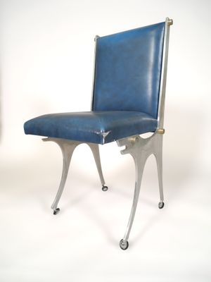 a blue chair that is on wheels on a white background