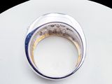 a ring that is sitting on top of a white plate