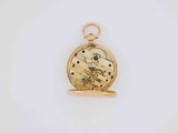 an image of a gold pocket watch on a white surface