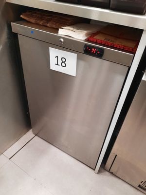 a stainless steel dishwasher with a number on it in a kitchen