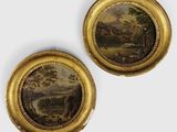 une paire de tableaux représentant un paysage, dans un cadre doré