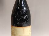 a bottle of wine that is sitting on a table