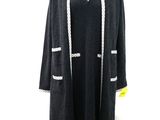 an image of a black and white coat on a mannequin