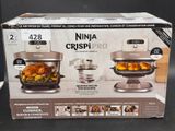 boxed box of ninja crispi pro with chicken and vegetables in it