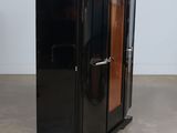 an image of a black cabinet with a wooden door