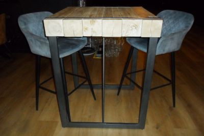 a picture of a table with two chairs and a wine glass