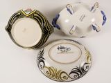 three different types of porcelain bowls and a bowl on a white surface