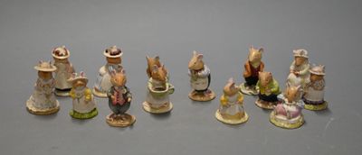 many figurines that are lined up on a table