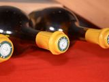 three bottles of wine that are sitting on a table