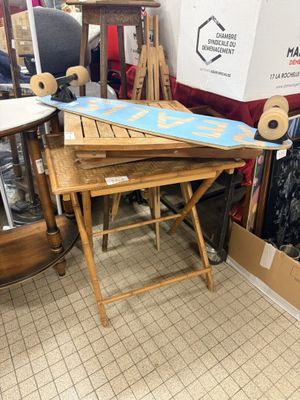 a table with a surfboard on top of it in a room